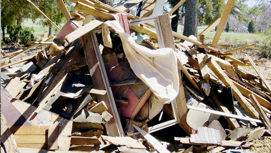 Demolition of a House Rubble Dumpster